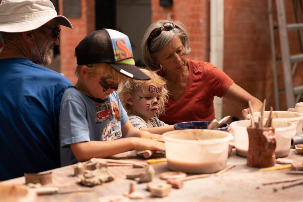 Family making pottery together
