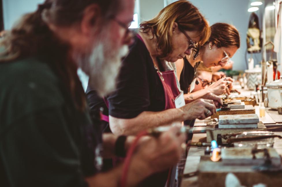 Students taking a metalworking class