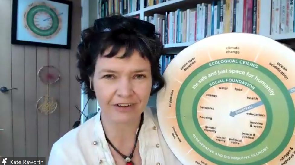 Photo of a woman holding a circular chart