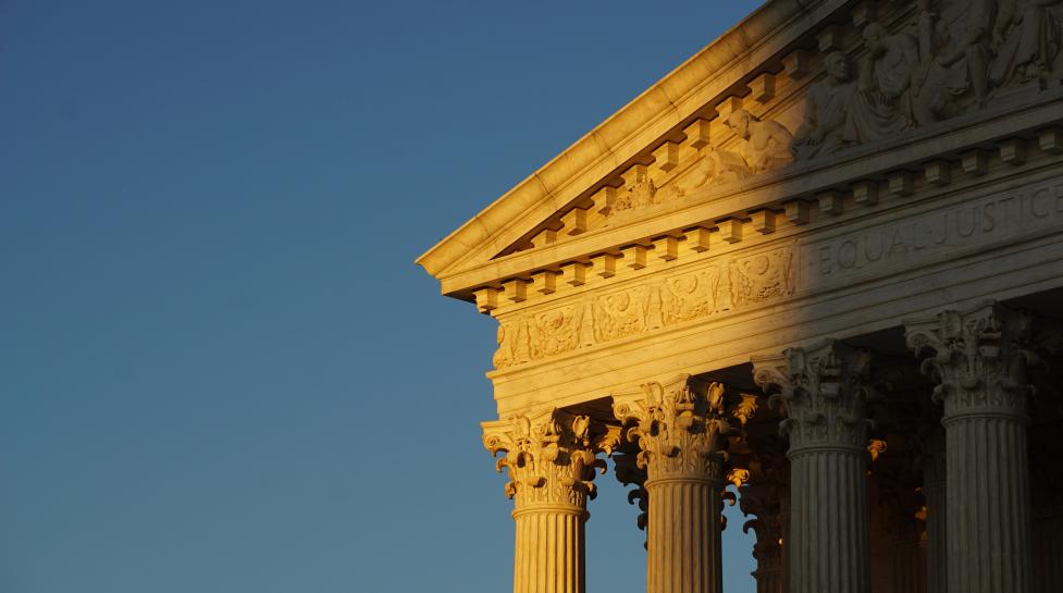 The sun sets on a corner of the supreme court building in Washington DC