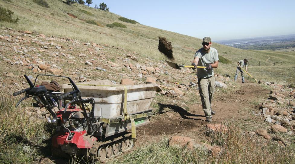 An OSMP Trail Crew member works on city open space
