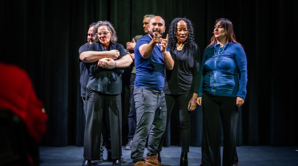 Improv theater group performing onstage