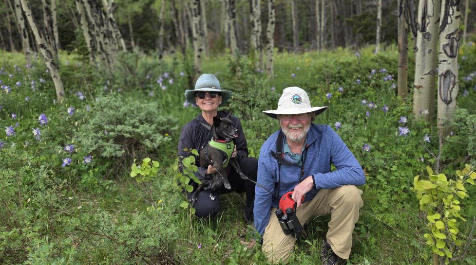 OSMP Dog Ambassadors, Don and Lisa Gillespie, with their dog Milo.