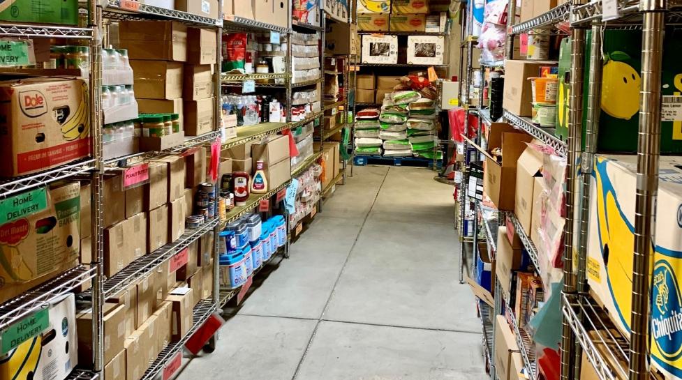 Stocked food bank shelves