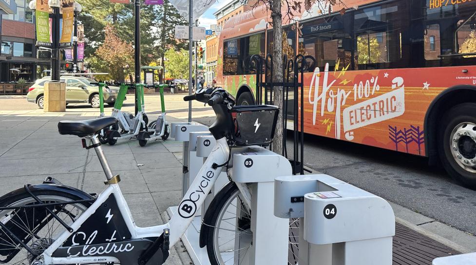 BCycle, lime e-scooters and HOP bus traveling downtown
