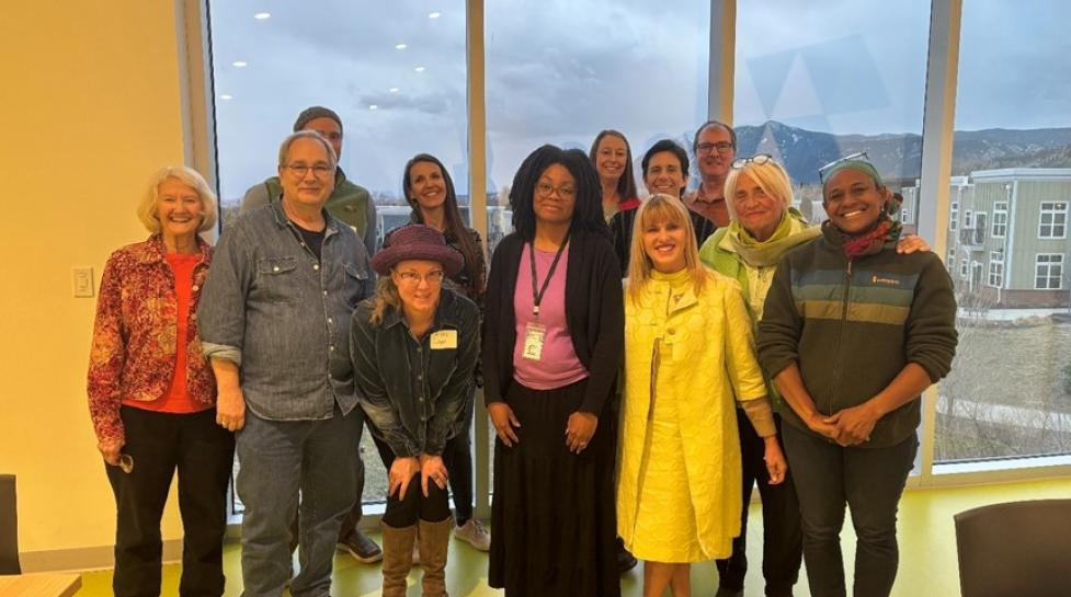 Group of racially diverse people standing together smiling