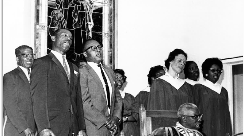 Rev. Hill and choir with stained glass window behind. May 1966. Boulder Daily Camera