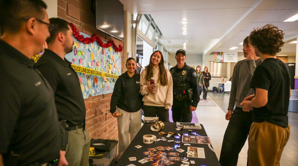 Boulder Police Officers and youth doing outreach at a spring lunch event.