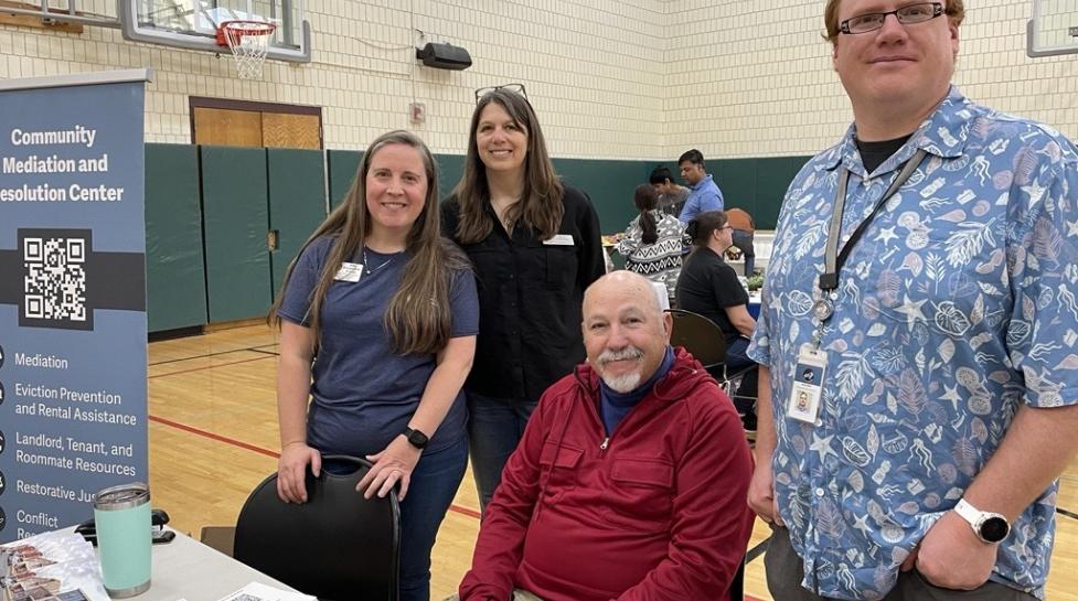 City and partner staff doing outreach for the Community Mediation and Resolution Center programs at the Housing Resource Fair 