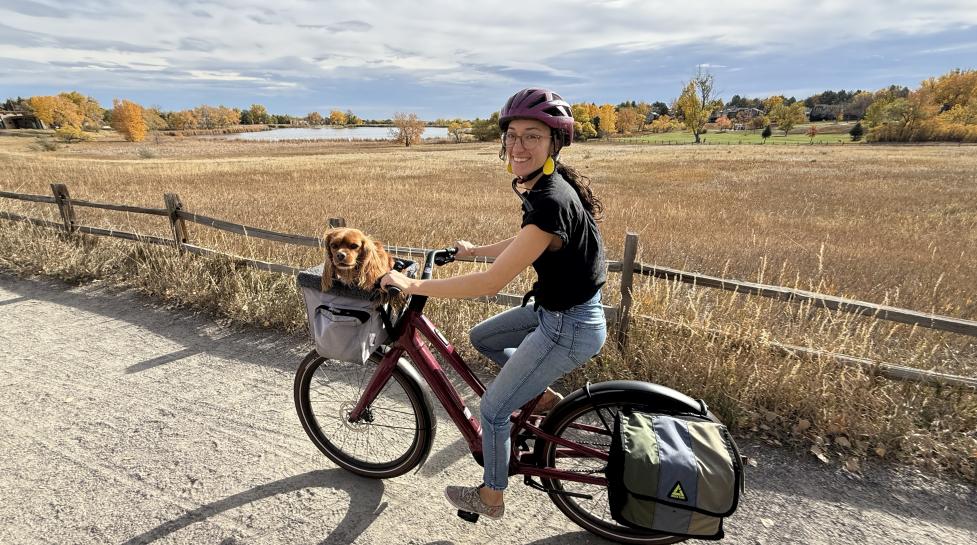 Rachel Alba with a dog and a bike
