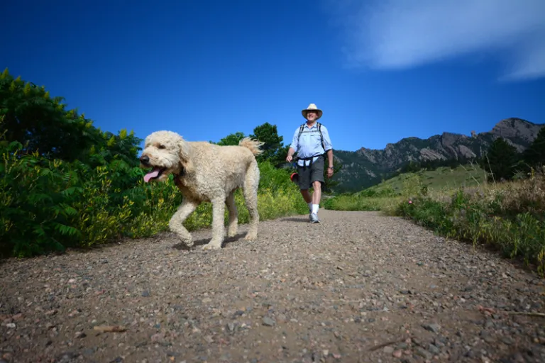Man hiking with his dog