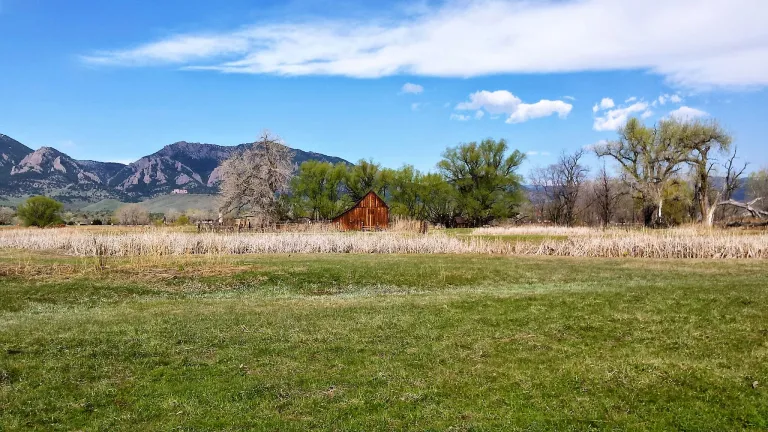 View of a barn from South Boulder Creek Trail in spring