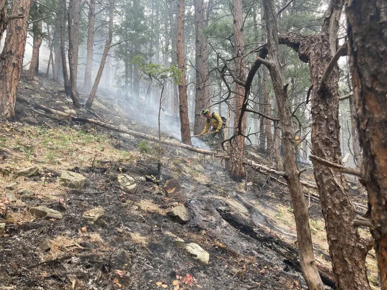 Firefighter working on OSMP land near NOAA