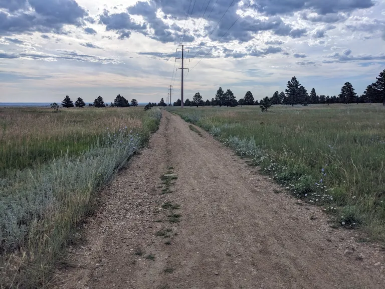 Flatirons Vista North Trail, a wide, gravel path, looking east
