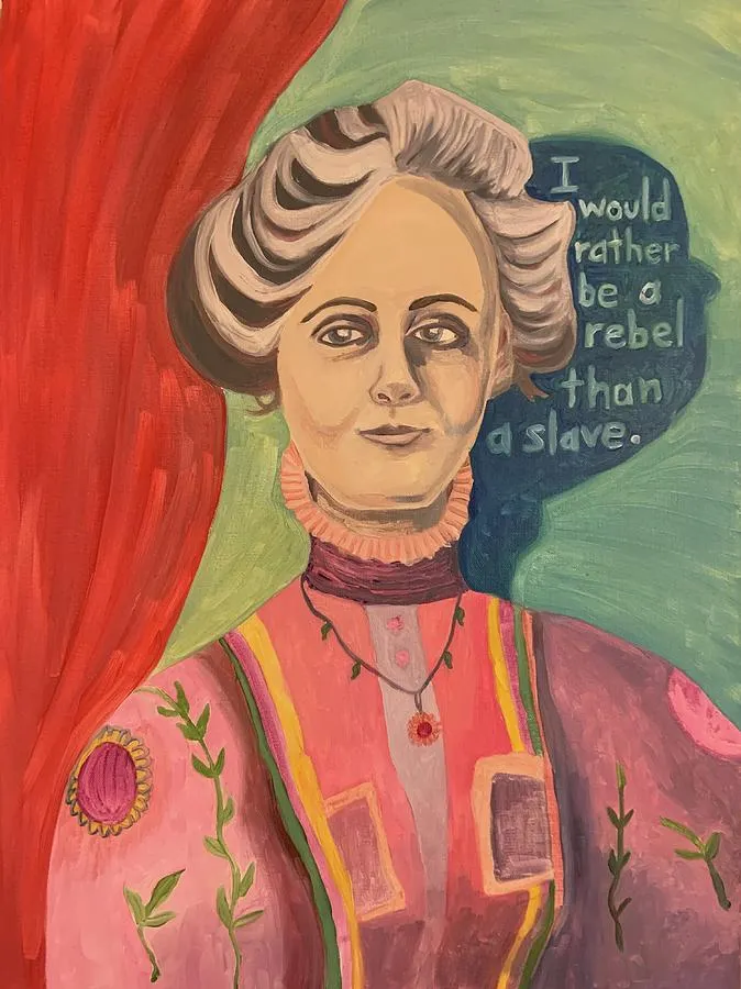 Portrait of a woman in colorful clothes with a quote behind her
