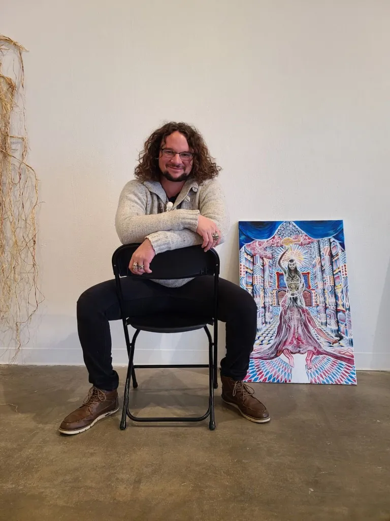 Artist next to mural of timeless vignettes 