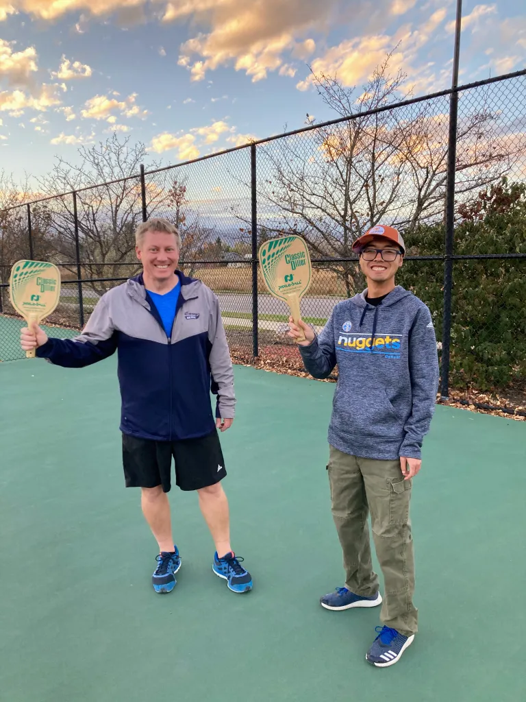 EXPAND volunteer and participant on the pickleball court