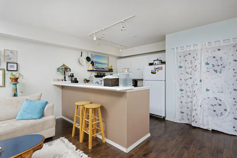 10 - 2610 Iris Ave Unit 105 - kitchen view from living space.jpg