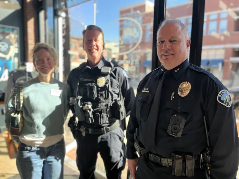 Boulder Police offers smiling for the camera at a past Coffee with a Cop event