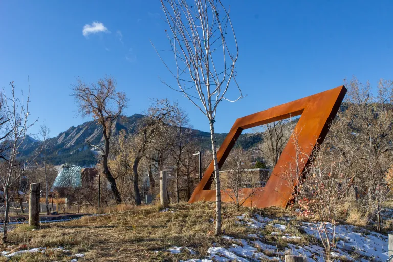 Sculpture in perspective of the library behind