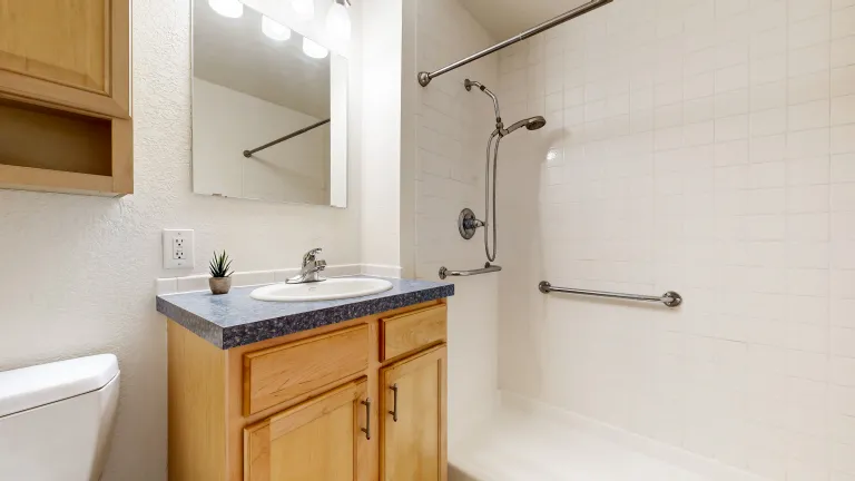 Bathroom picture with shower toilet and sink