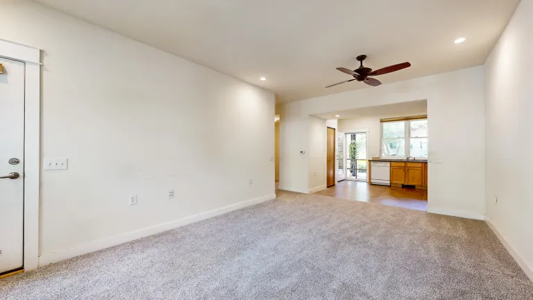 Livingroom view looking at kitchen open space