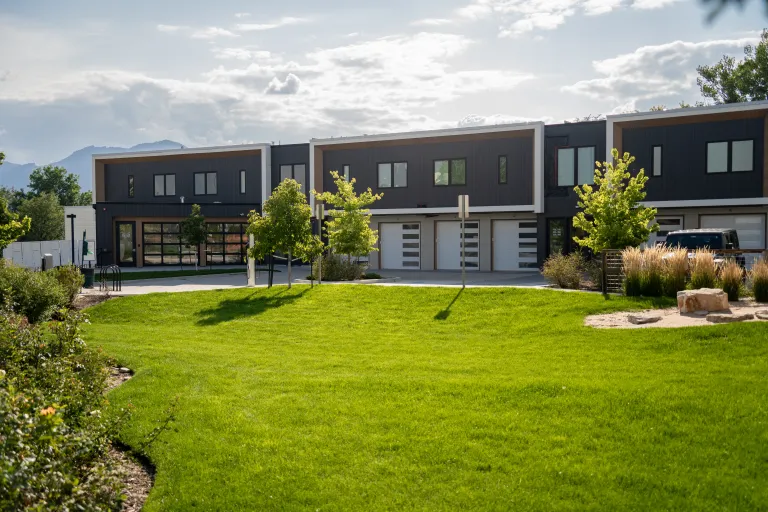 3261 Airport Rd Unit D-105 Building view a far and lawn view outside