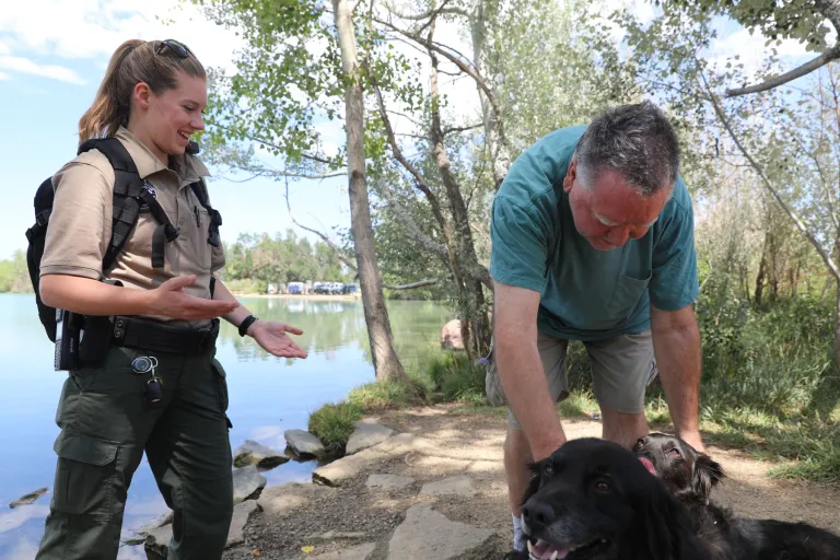 Boulder Parks and Recreation Ranger helping community member