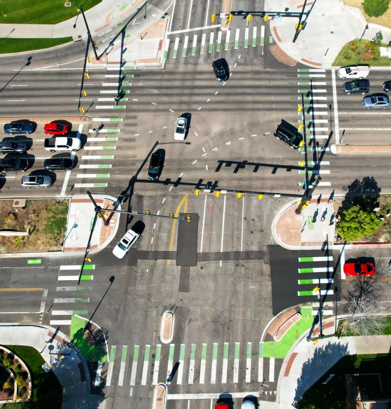 28th and Colorado intersection from above. Buses, cars, bikes and people walking travel. 