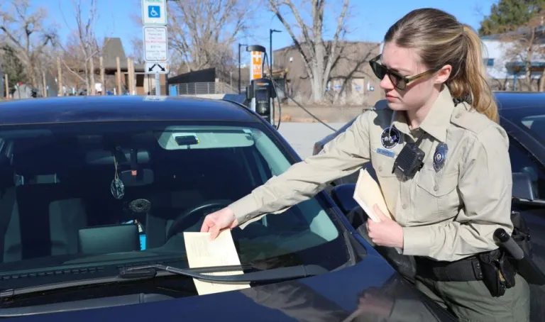 Boulder Parks and Recreation Ranger issuing a citation