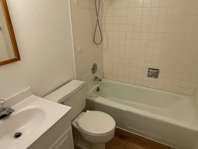 3150 Iris Ave #F211 - shared full bathroom with bathtub new flooring in hallway