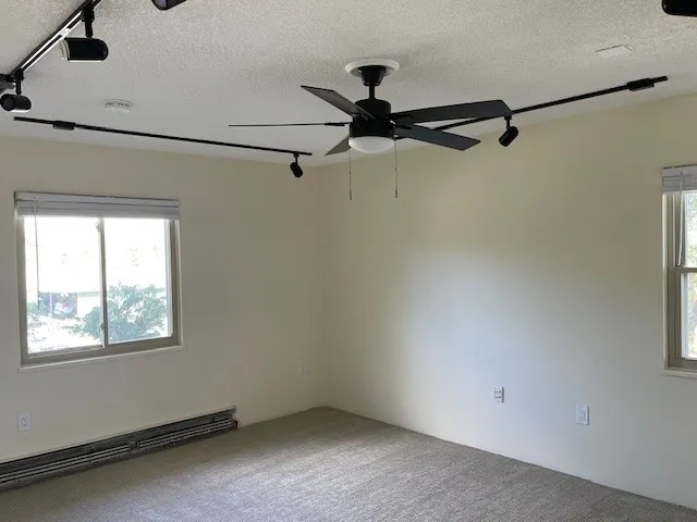 3150 Iris Ave #F211 - primary bedroom with lots of light new ceiling fan