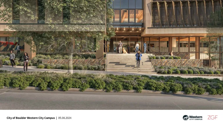 outside of large building with lots of windows and wide stairway to entrance doors.