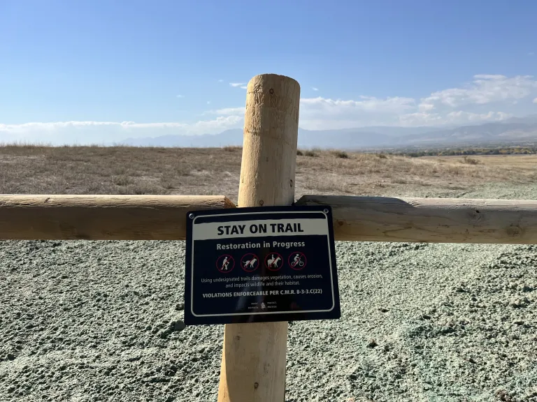 Restoration area sign prohibiting off-trail travel