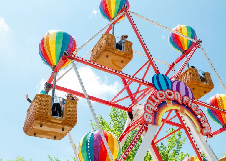 Colorful ferris wheel with riders