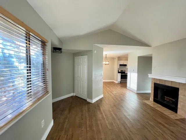 5540 Stonewall Pl 16 - Interior living room fireplace dining room kitchen view
