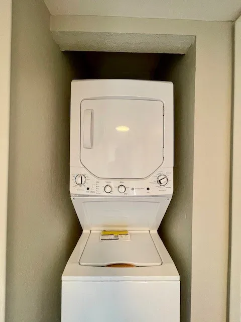 5540 Stonewall Pl 16 - Interior stacked washer and dryer in the hall