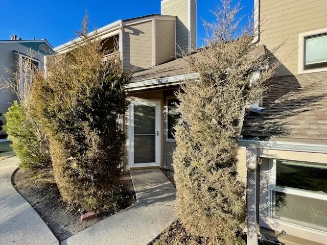 5540 Stonewall Pl 16 - Exterior front door surrounded by mature bushes