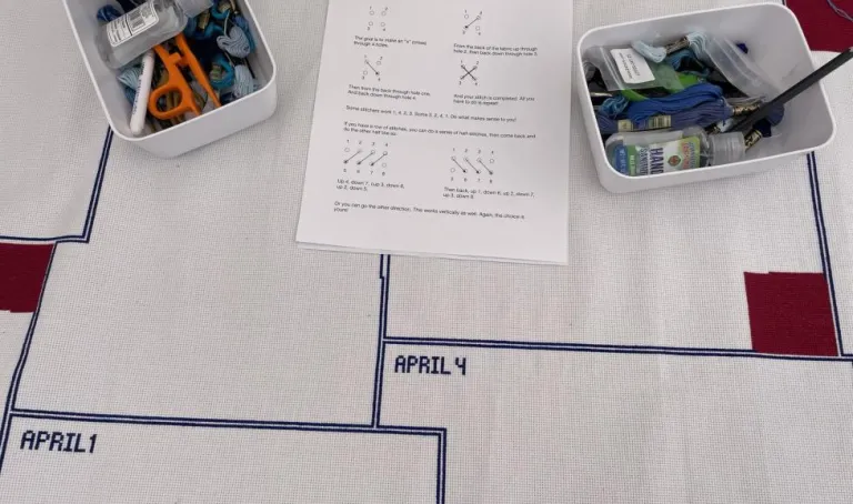 Stitching outlines on a table downtown