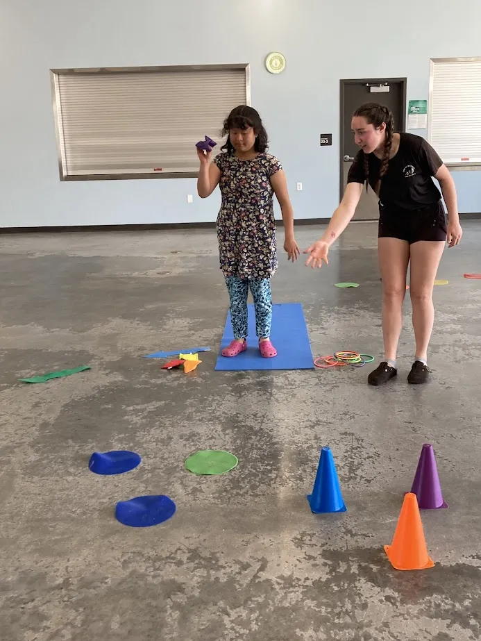 Amico campers playing a game indoors