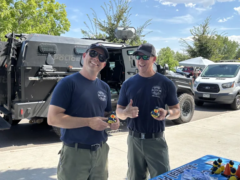 two firefighters smiling 