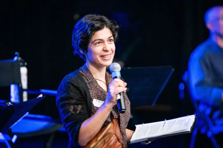Motus employee on stage during the Elevate Boulder monologue performance at Motus Theater.