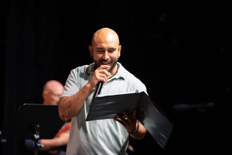 Motus Theater employee on stage during the Elevate Boulder monologue performance at Motus Theater.