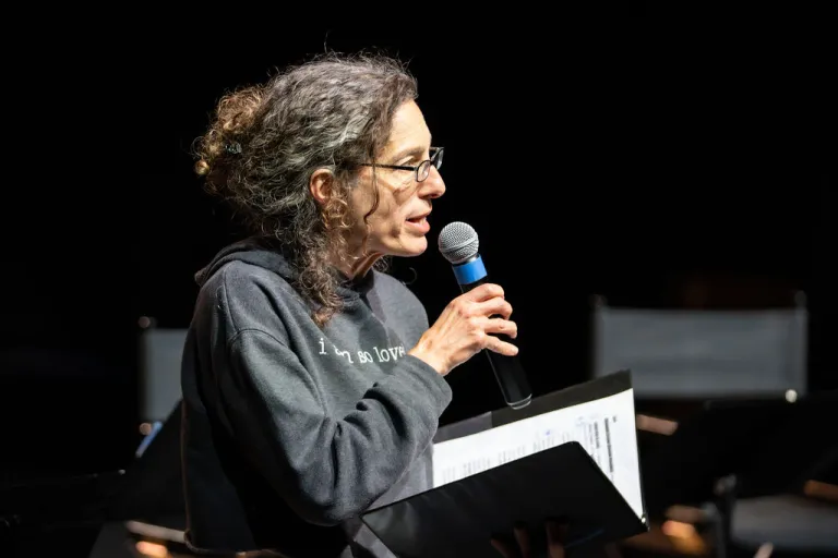 Motus Theater employee on stage during the Elevate Boulder monologue performance at Motus Theater.