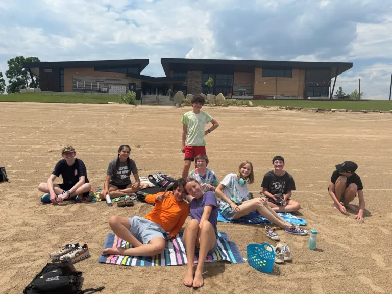 Camp Amico campers hang out on the Boulder reservoir beach.