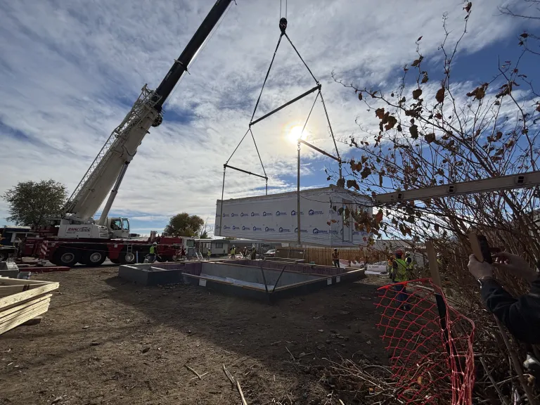 First section of modular home being placed on the foundation. 