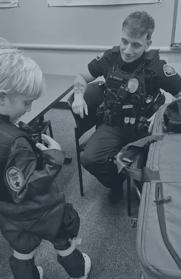 BPD Officer with kid in PD costume