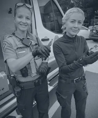 BPD Officers smile for a photo outside of the animal control vehicle
