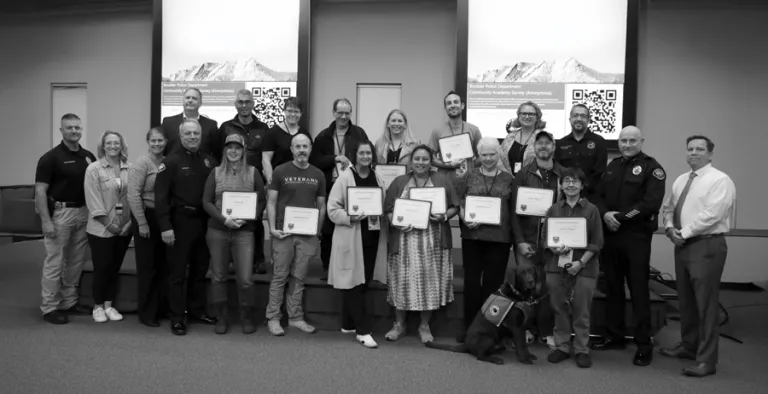 BPD Community Academy attendees smile for a photo after the completion of the academy