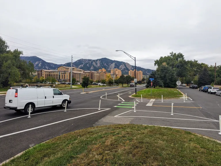 paint and flexible-post protected road with green bike crossing